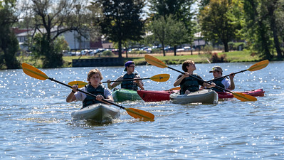 Students kayaking in the river.