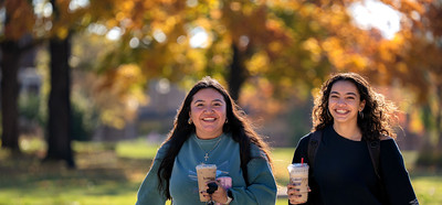 Students walking campus during the fall