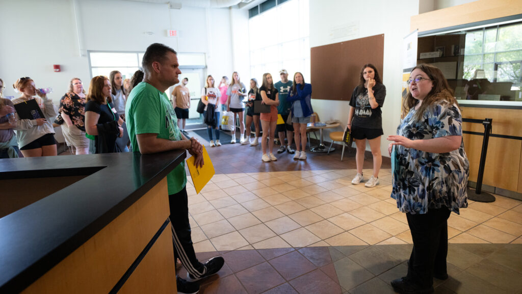 Student giving a tour through Taylor Hall