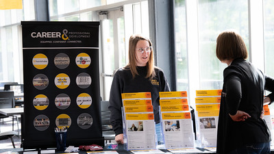 Student at Career & Professional Development information table