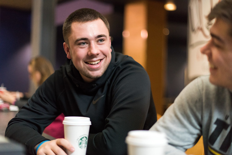 Two students enjoying Starbucks coffee on UW-Oshkosh campus