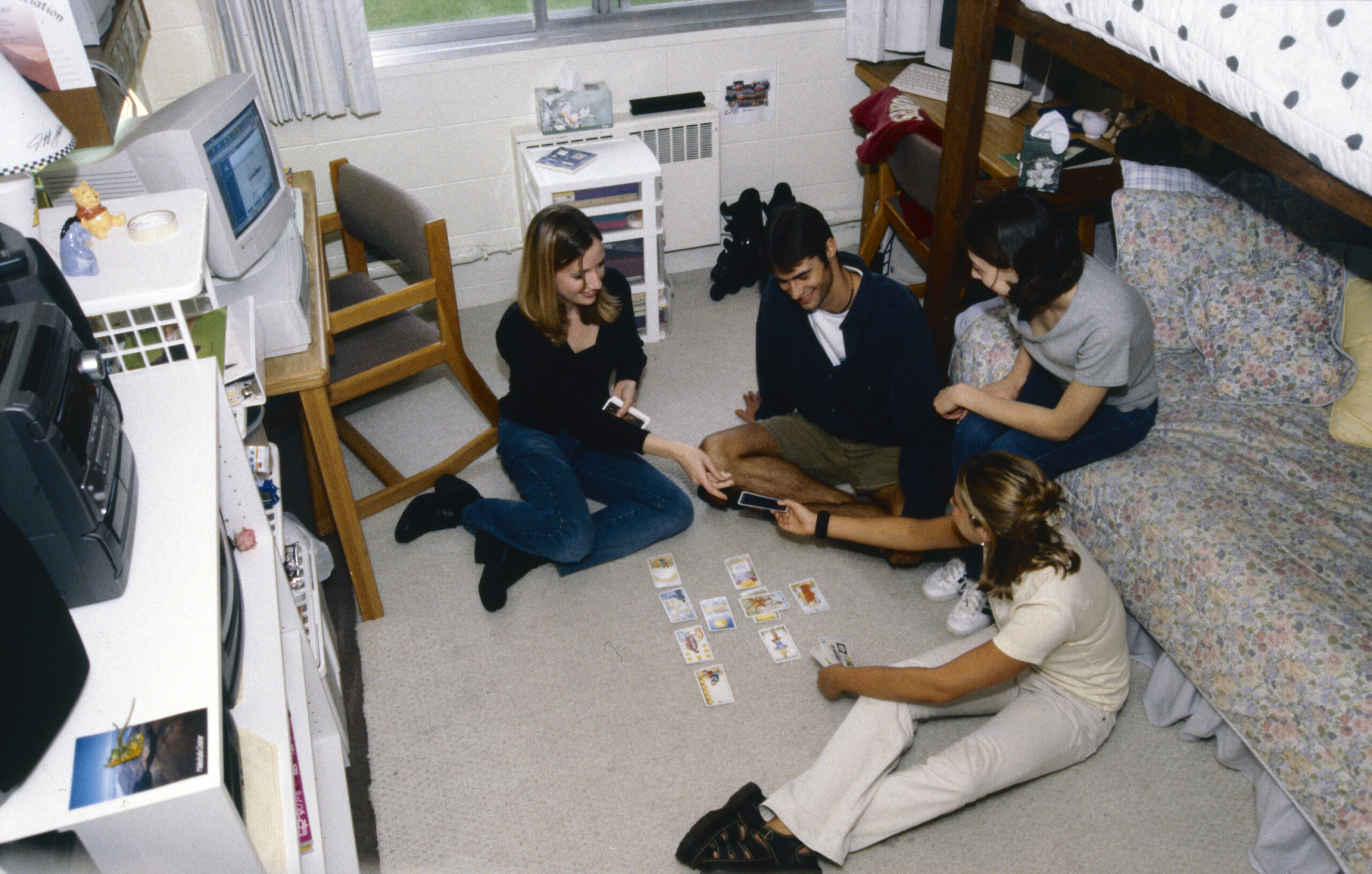 Students playing cards in the dorms in the 2000s.