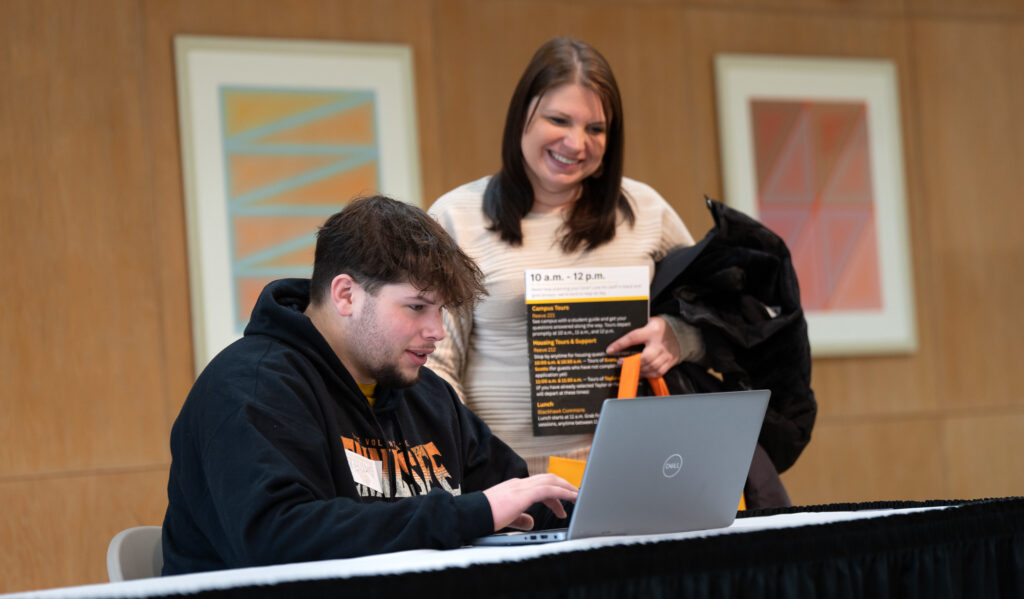 Student using a laptop to enroll in courses