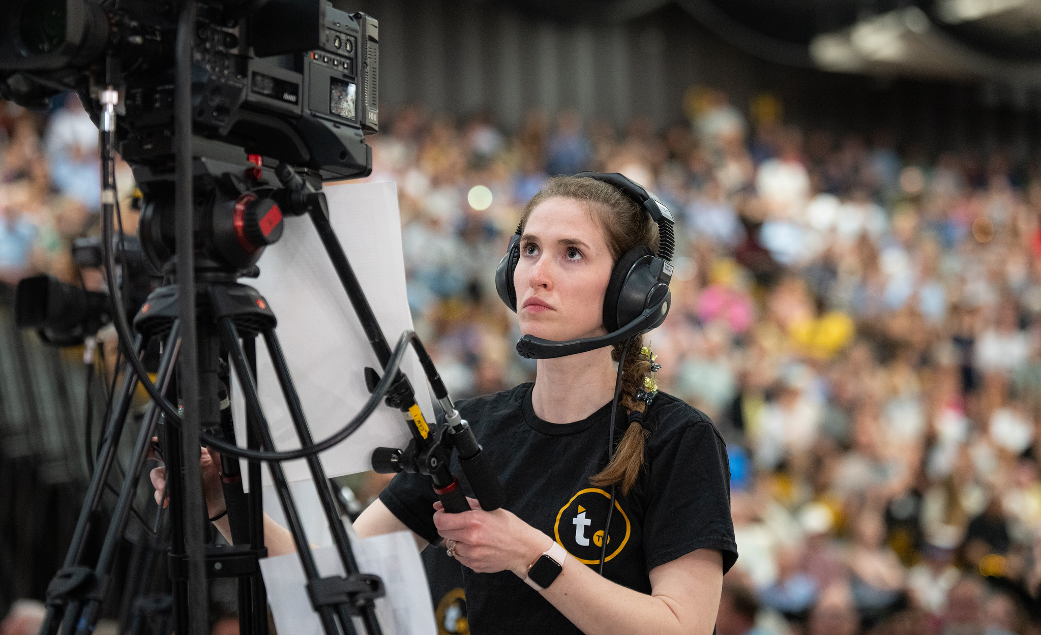 Titan TV student videotaping UW-Oshkosh spring 2026 commencement