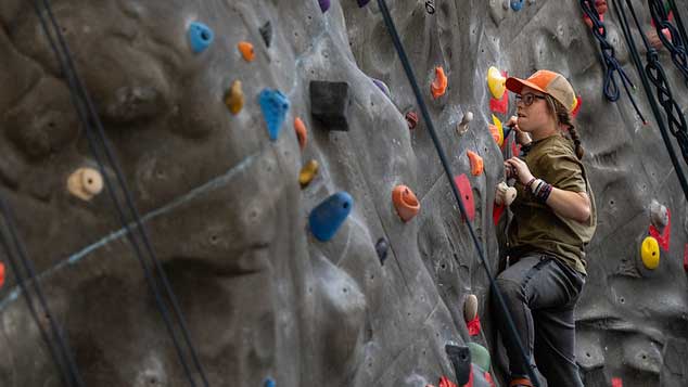 A student rock climbing